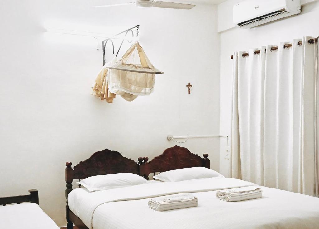 Postel nebo postele na pokoji v ubytování Reds Residency - Homestay