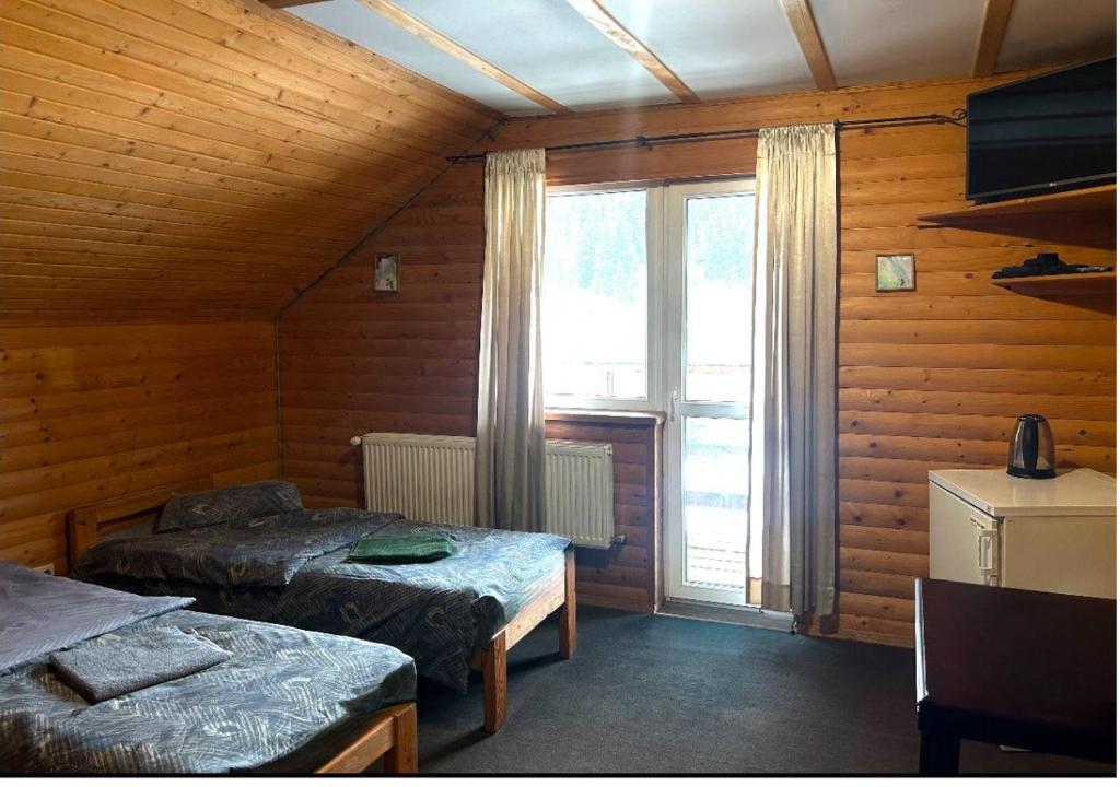 Postel nebo postele na pokoji v ubytování Готель Могул