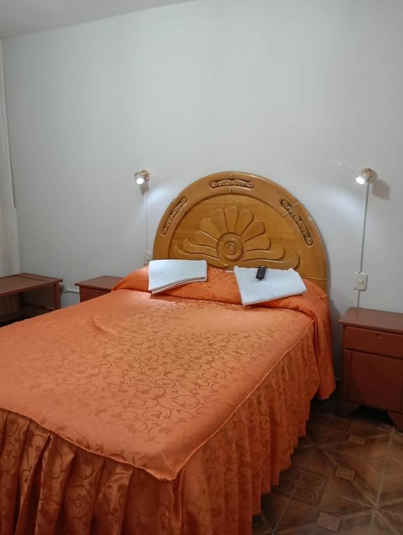 Postel nebo postele na pokoji v ubytování Mi casa Tacna