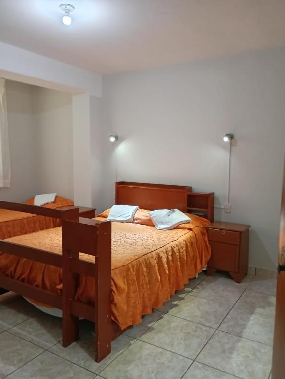 Postel nebo postele na pokoji v ubytování Mi casa Tacna