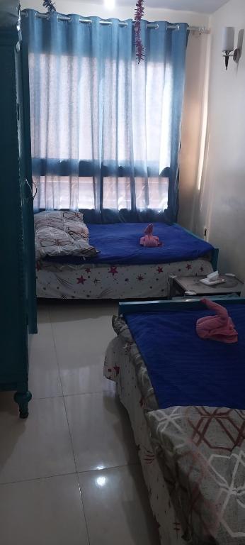 Postel nebo postele na pokoji v ubytování Sun Hostel
