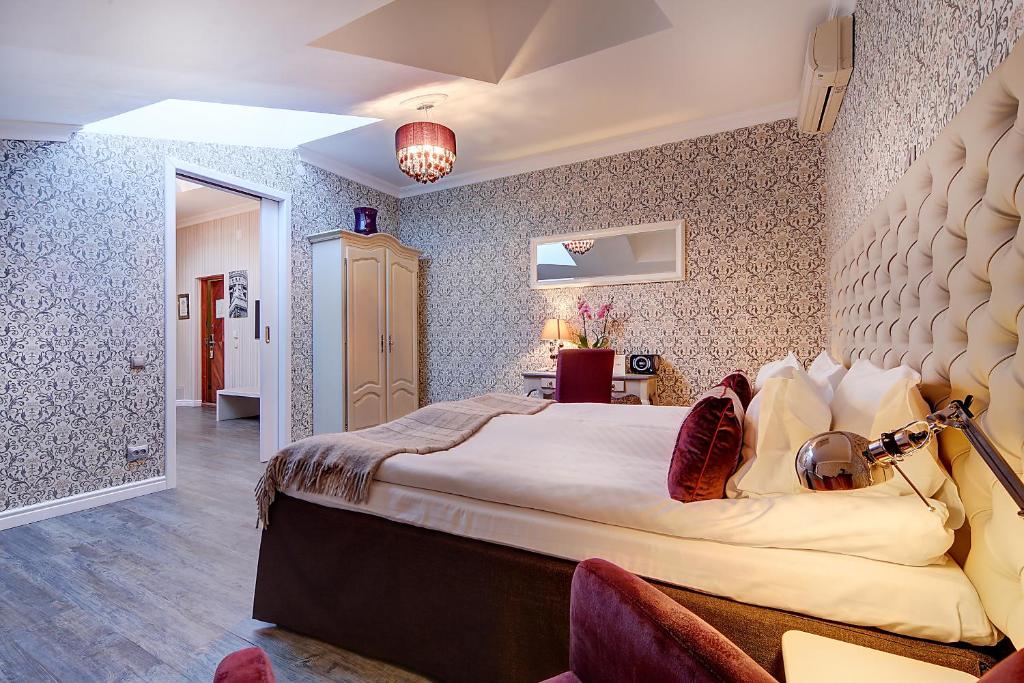 a bedroom with a large bed in a room at Pushka INN hotel in Saint Petersburg