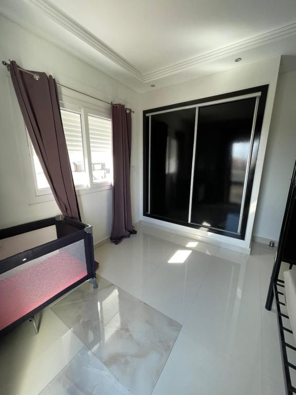 Postel nebo postele na pokoji v ubytování Residence Riad Saïdia