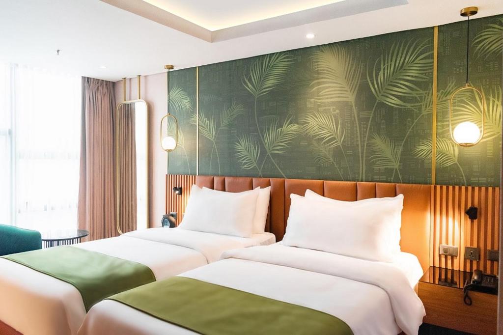 Voodi või voodid majutusasutuse Ironwood Hotel toas