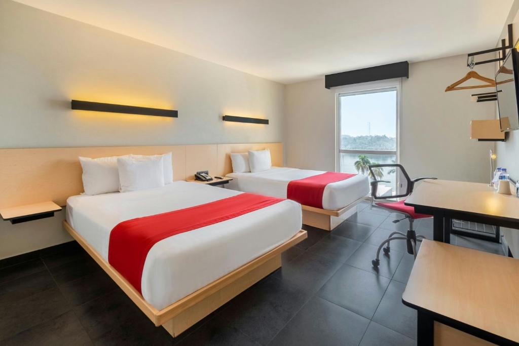 Letto o letti in una camera di City Express by Marriott Tuxpan