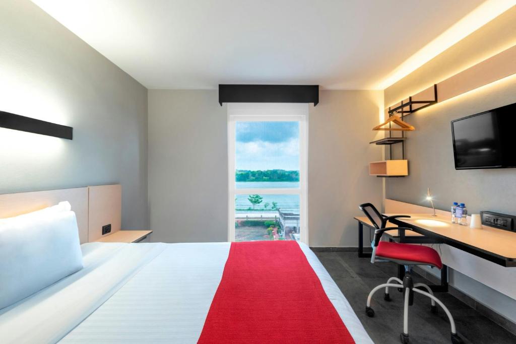 Letto o letti in una camera di City Express by Marriott Tuxpan