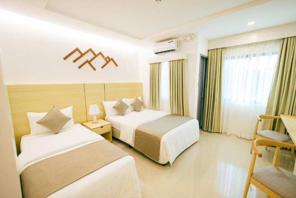 Postel nebo postele na pokoji v ubytování Panglao Vista Suites by SMS Hospitality