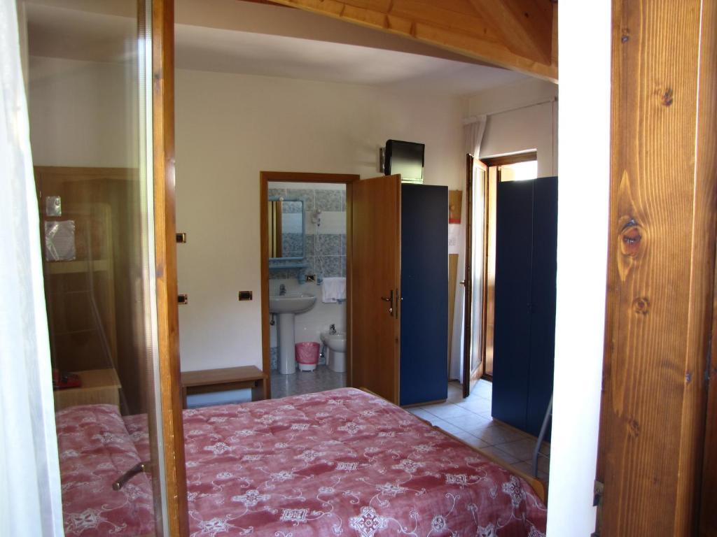 Postel nebo postele na pokoji v ubytování Hotel Serena