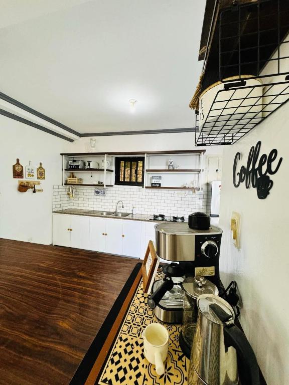 a kitchen with a coffee machine on a counter at Dreamscape Villa in Batangas City