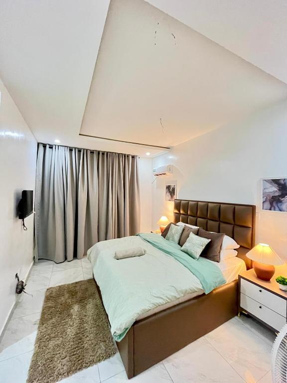 Postel nebo postele na pokoji v ubytování Mide Apartment Ajah Lagod