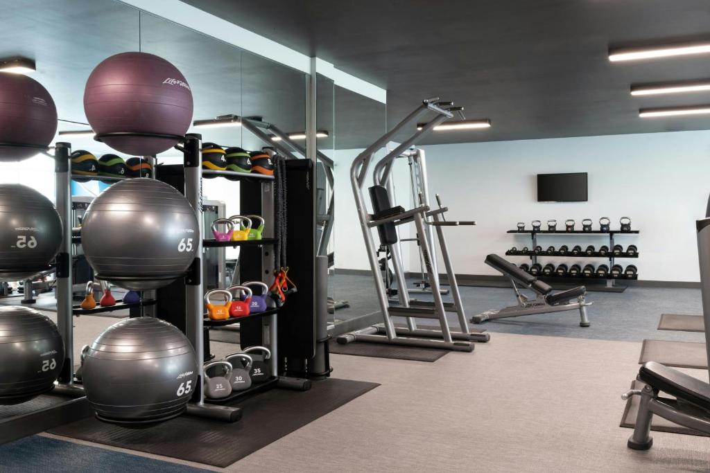 a fitness room with a gym with weights at Aloft Sarasota in Sarasota