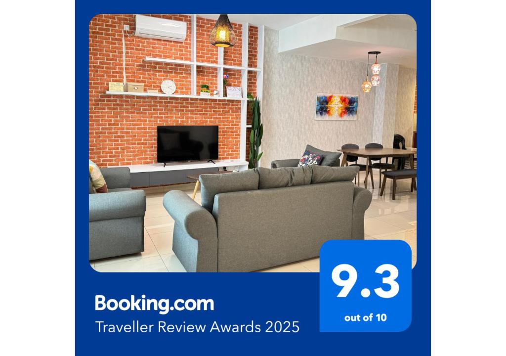 a living room with a couch and a fireplace at De Home Desaru Harmonia 5GWiFi Netflix BBQ 41OK7 in Bandar Penawar