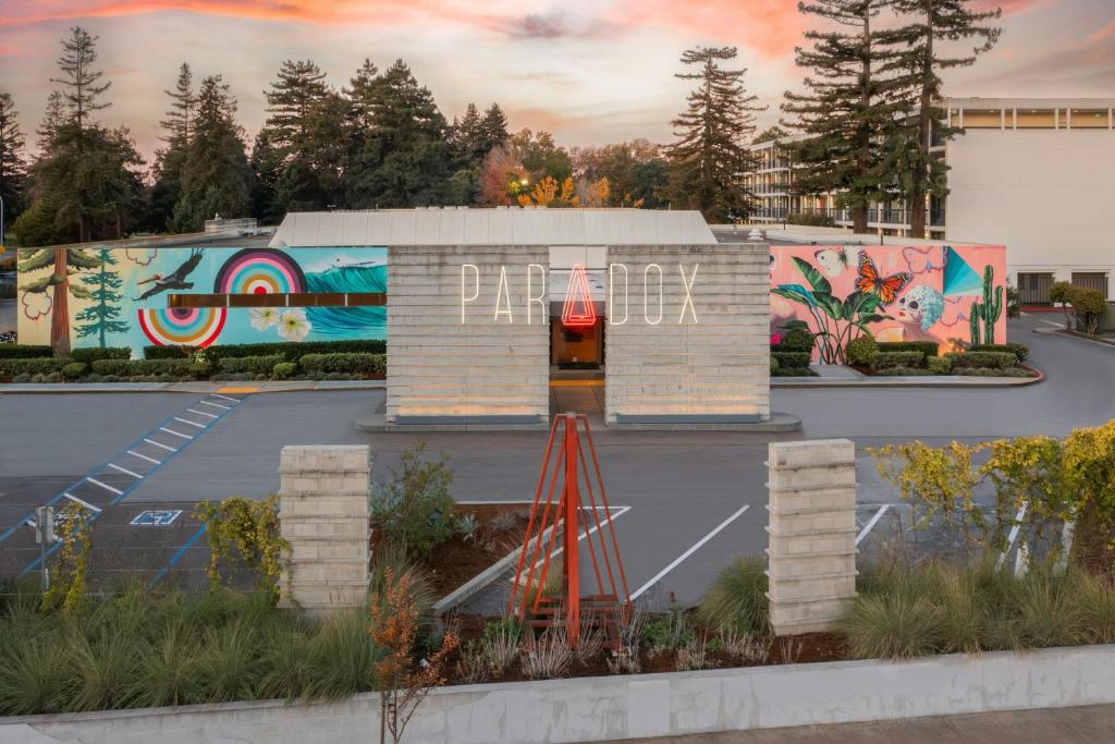 a building with graffiti on it in a parking lot at Hotel Paradox, Autograph Collection in Santa Cruz