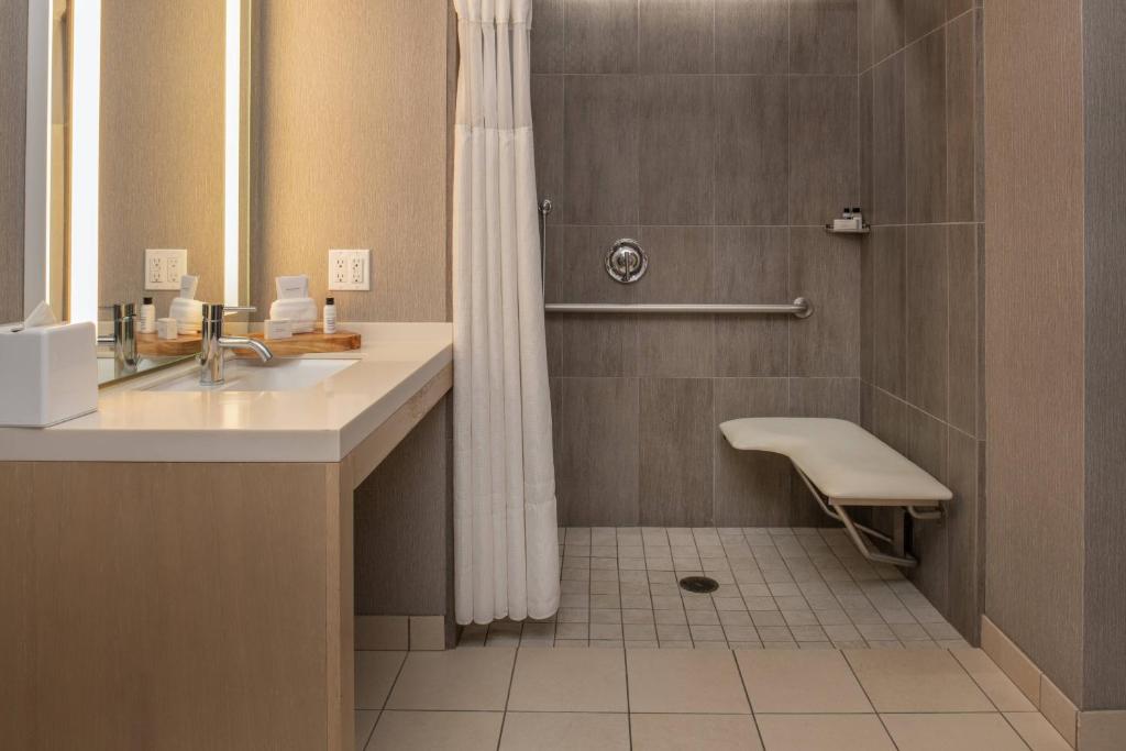 a bathroom with a sink and a shower at Hotel Paradox, Autograph Collection in Santa Cruz
