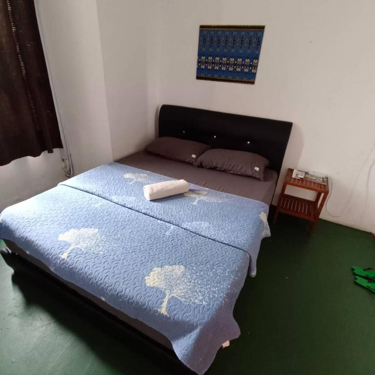 Postel nebo postele na pokoji v ubytování Tabun Homestay