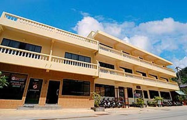 a large building with a balcony on top of it at Kata View Guest House in Kata Beach