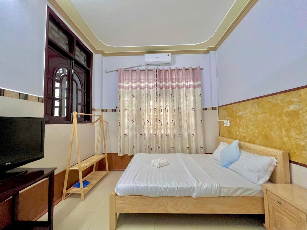 Postel nebo postele na pokoji v ubytování Mekong INN