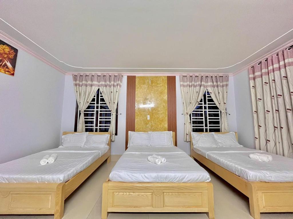Postel nebo postele na pokoji v ubytování Mekong INN