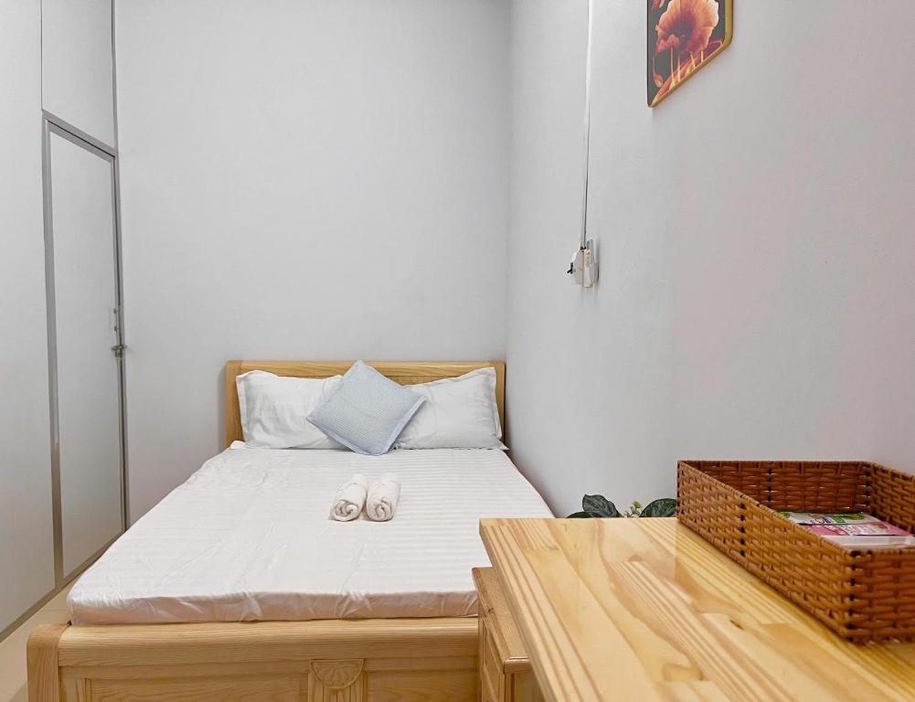 Postel nebo postele na pokoji v ubytování Mekong INN