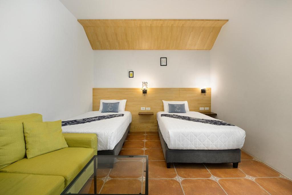 Postel nebo postele na pokoji v ubytování 康逸旅宿Comeinn2