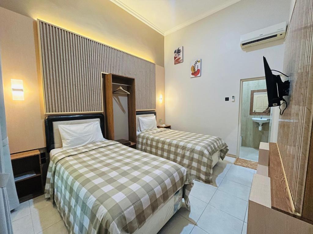 Postel nebo postele na pokoji v ubytování Clover Homestay