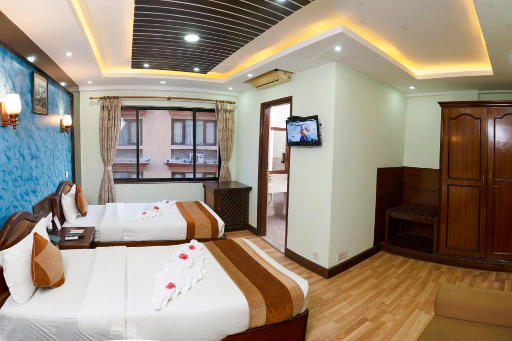 Postel nebo postele na pokoji v ubytování Samsara Boutique Hotel