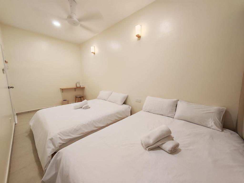 Postel nebo postele na pokoji v ubytování No 8 Homestay