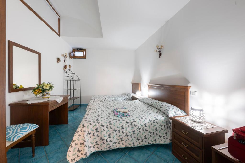 Postel nebo postele na pokoji v ubytování La Cascina - Villa Nenno