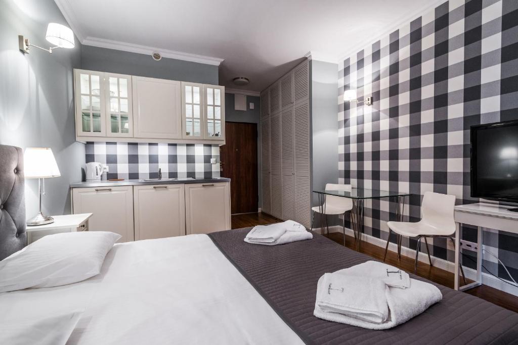Posteľ alebo postele v izbe v ubytovaní Triton Park Apartments