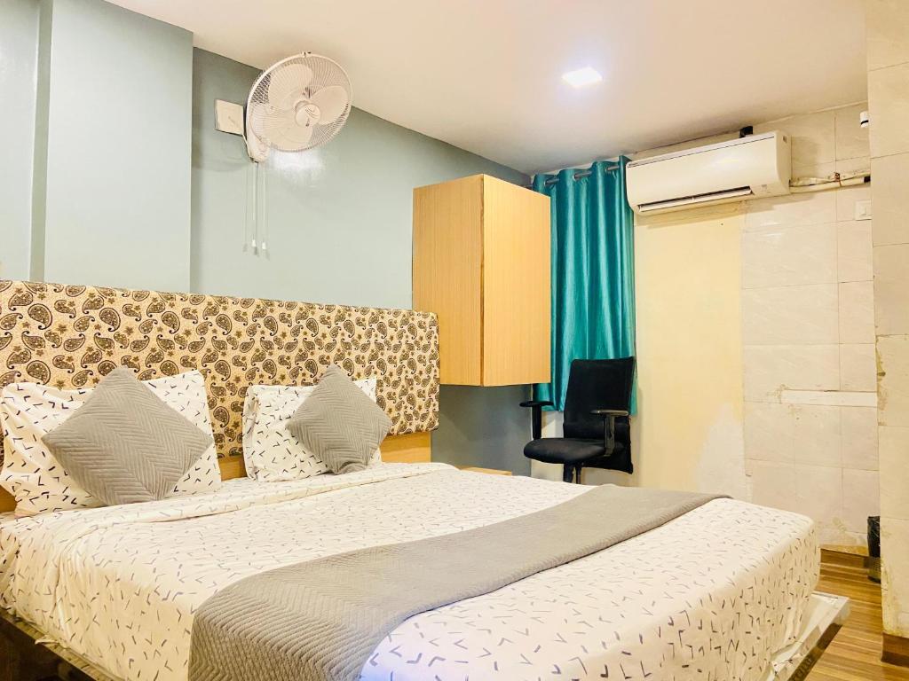 Postel nebo postele na pokoji v ubytování Hotel ABC Satellite Prahlad Nagar