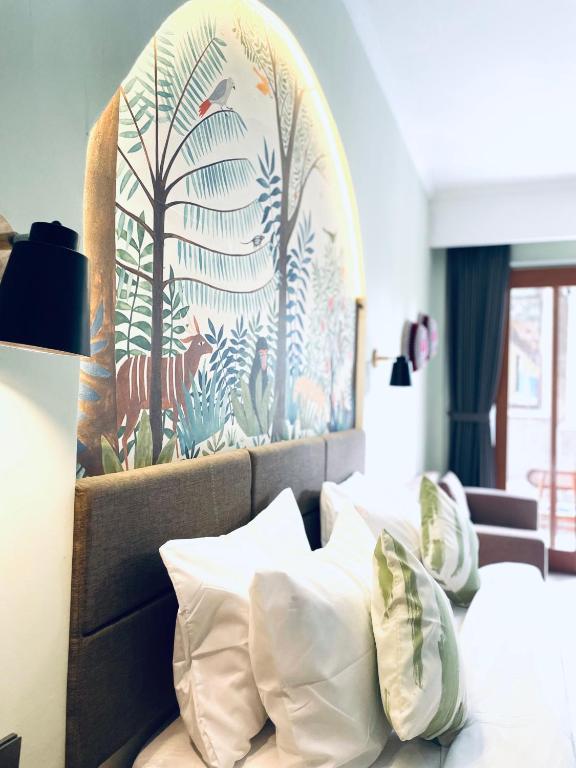 Postel nebo postele na pokoji v ubytování Rumah Baris Ubud