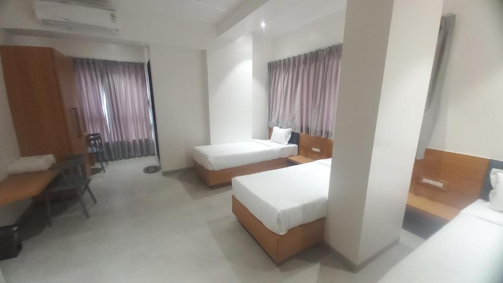 Postel nebo postele na pokoji v ubytování Hotel Elite
