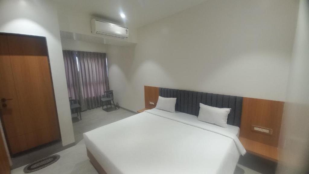 Postel nebo postele na pokoji v ubytování Hotel Elite