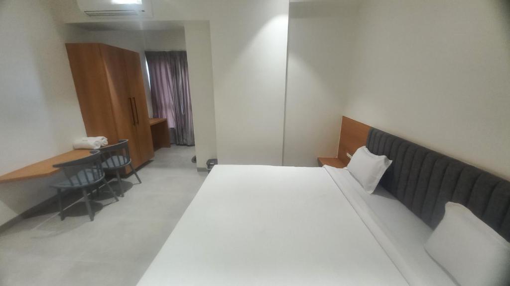 Postel nebo postele na pokoji v ubytování Hotel Elite