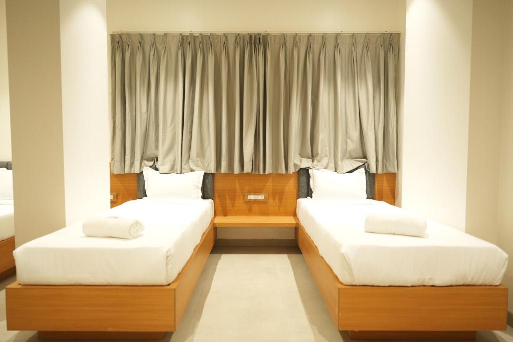 Postel nebo postele na pokoji v ubytování Hotel Elite