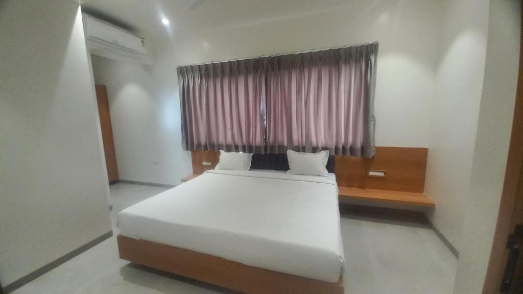 Postel nebo postele na pokoji v ubytování Hotel Elite