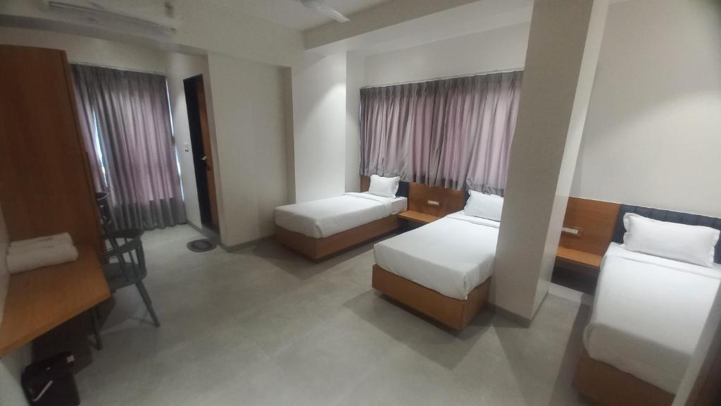 Postel nebo postele na pokoji v ubytování Hotel Elite