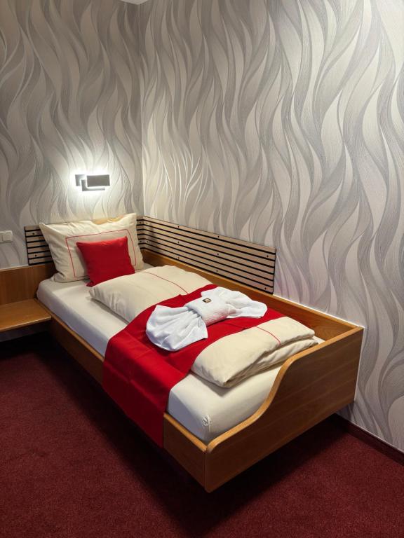Letto o letti in una camera di Ambiente Hotel Strehla