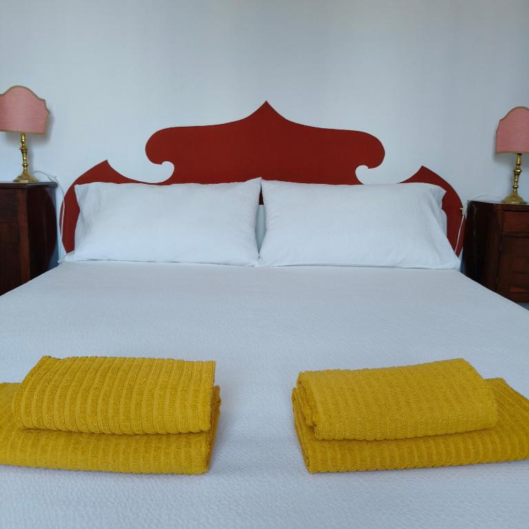 Postel nebo postele na pokoji v ubytování Radetzky Rooms