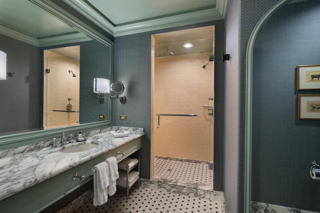 a bathroom with a large sink and a shower at Hotel ICON, Autograph Collection in Houston