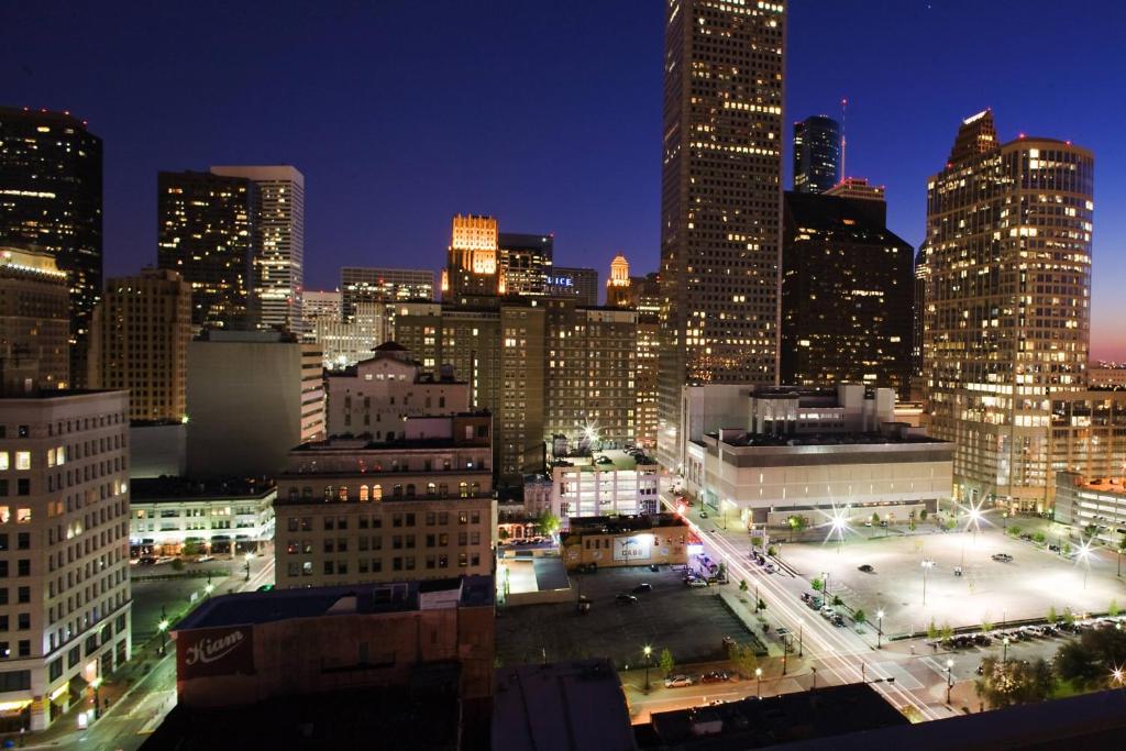 a view of a city skyline at night at Hotel ICON, Autograph Collection in Houston