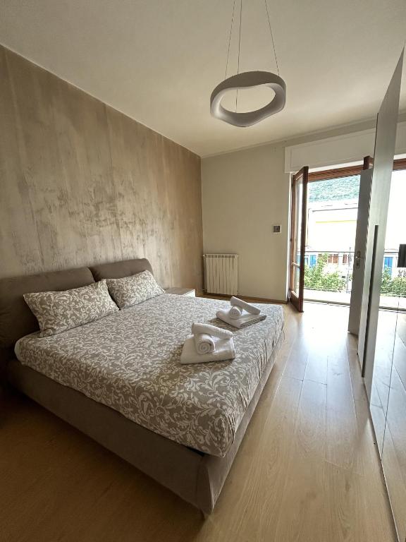 a bedroom with a bed with two towels on it at La Casa Del Matese in Piedimonte dʼAlife