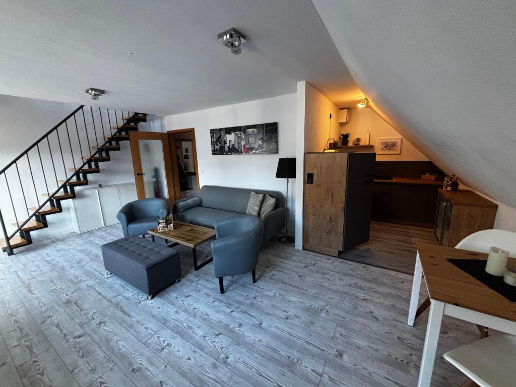 a living room with a couch and a table at Ferienwohnung in Erfurt Marbach (Maisonette) in Erfurt