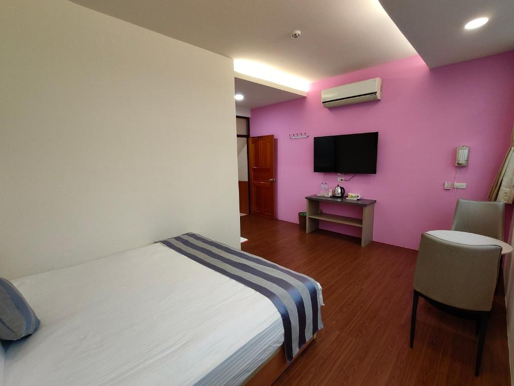 Postel nebo postele na pokoji v ubytování Xitou Tianpin Homestay