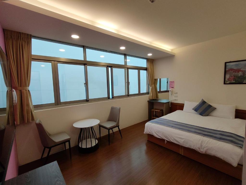 Postel nebo postele na pokoji v ubytování Xitou Tianpin Homestay