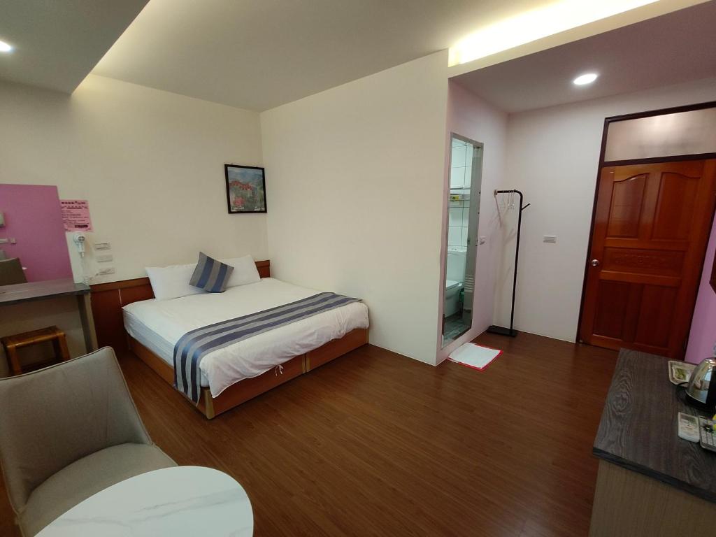 Postel nebo postele na pokoji v ubytování Xitou Tianpin Homestay