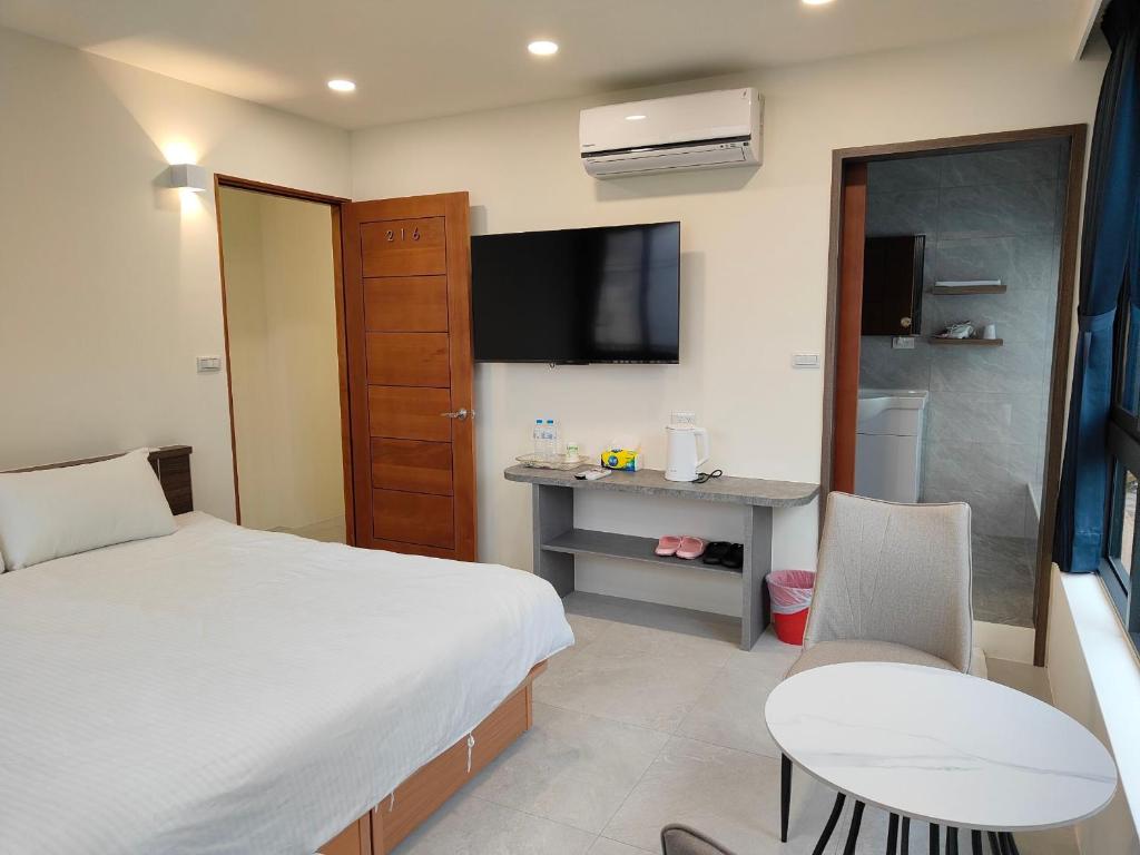 Postel nebo postele na pokoji v ubytování Xitou Tianpin Homestay