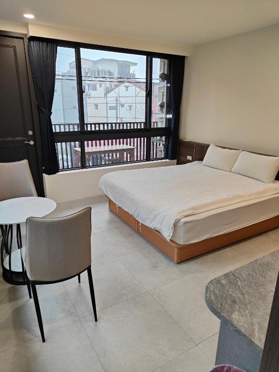Postel nebo postele na pokoji v ubytování Xitou Tianpin Homestay