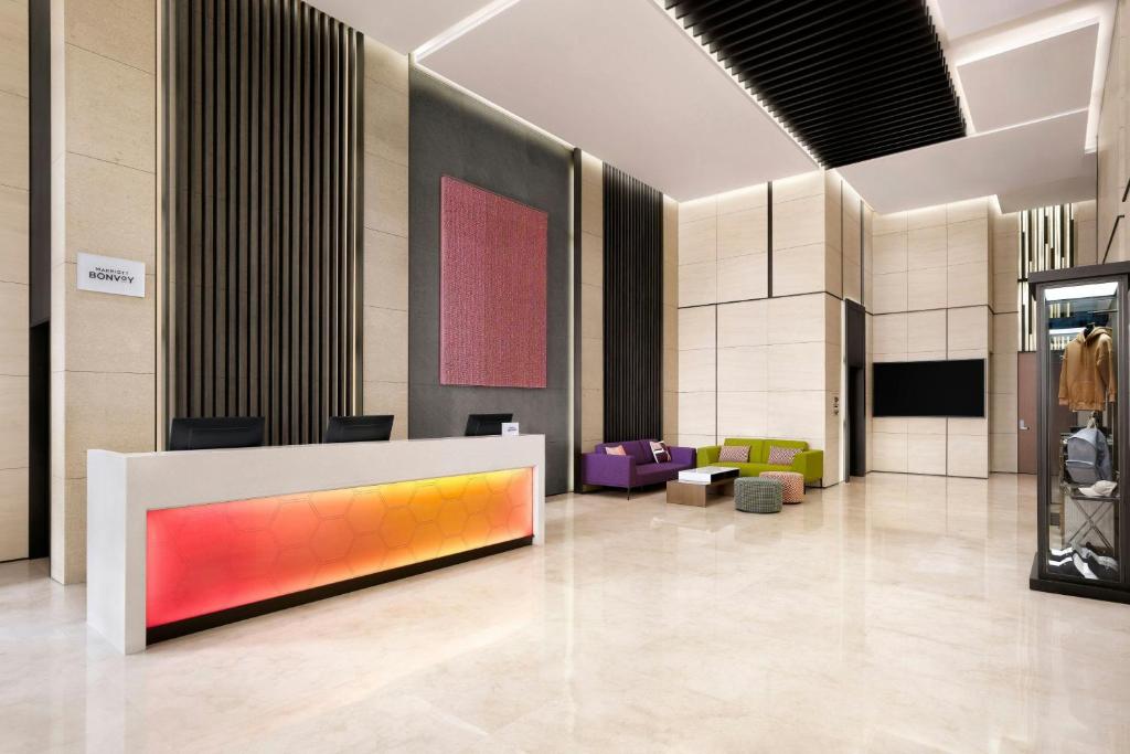 a lobby with a colorful wall at Aloft Seoul Myeongdong in Seoul