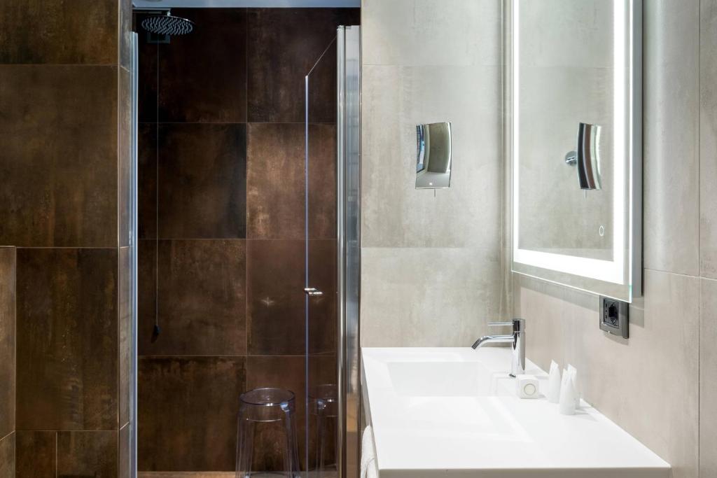a bathroom with a sink and a shower at AC Hotel Venezia by Marriott in Venice